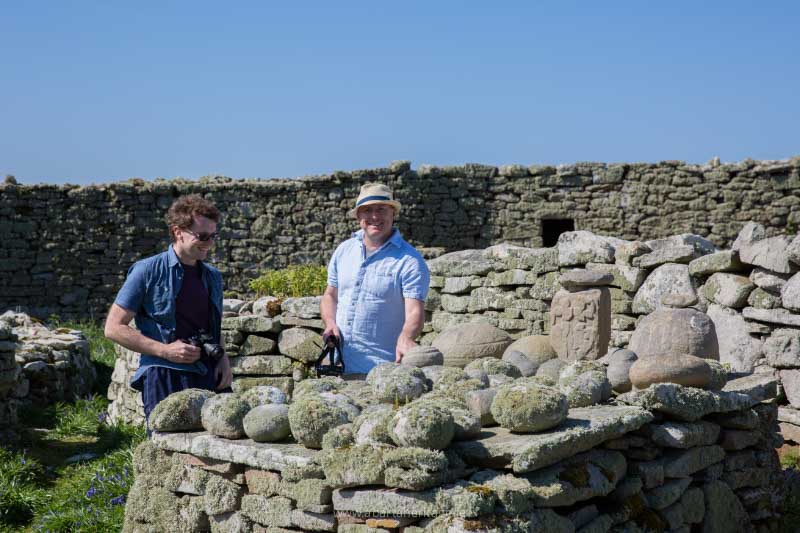 Dr James Bonsall and Dr Ros O Maolduin trying out the Cursing Stones