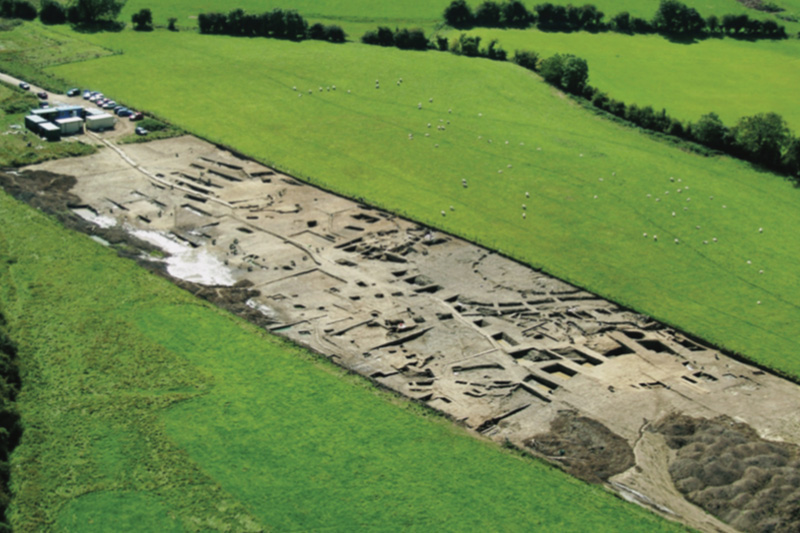 An aerial view of the early medieval site at Raystown under excavation (Courtesy of TII) as featured in the Meitheal Stories from Early Medieval Ireland Audiobook