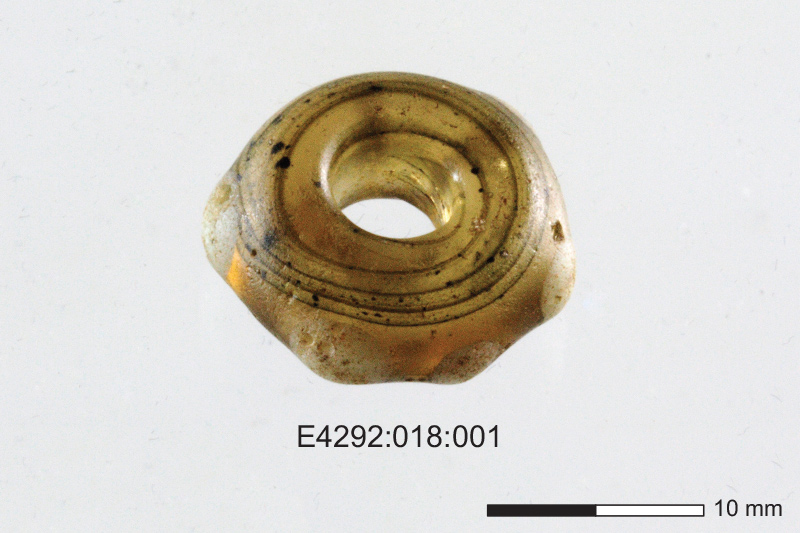 A glass bead that dates to the early medieval period. Found at Knockawaddra West 2.
