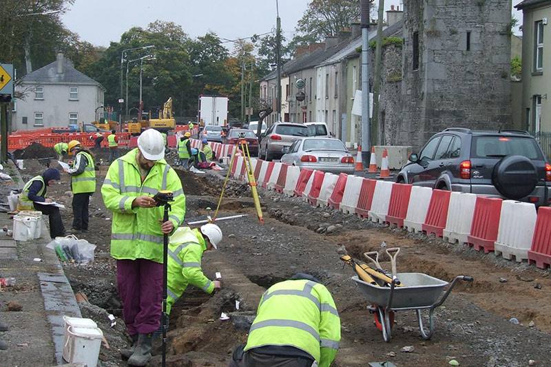 Archaeologists at work excavating features along the main street of Buttevant (courtesy of Rubicon Heritage and Transport Infrastructure Ireland)