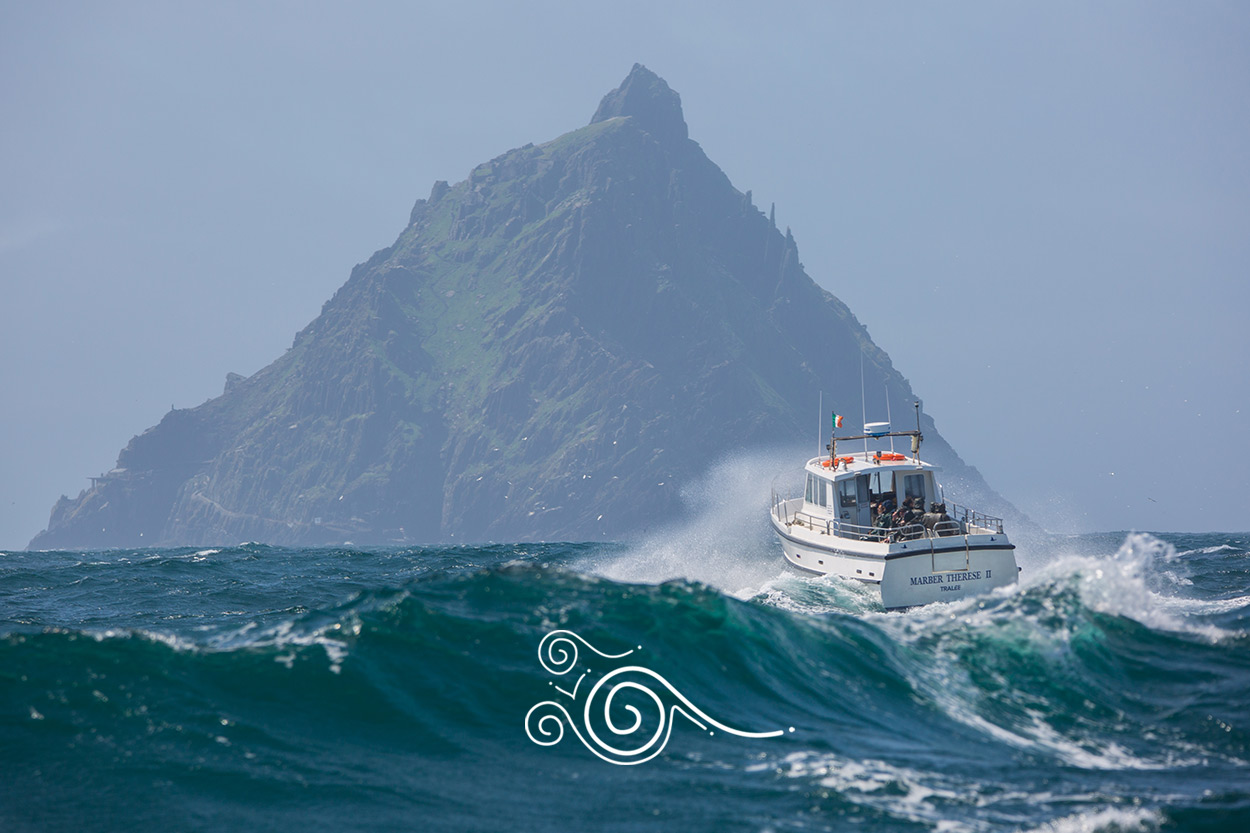 A boat crossing the Atlantic heading towards the pyramid-shaped peak of Skellig Michael