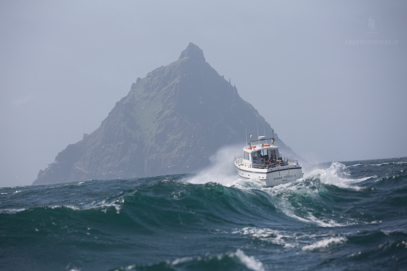 The Wild Atlantic Way in all its glory as a boat crests a wave on the way to Skellig Michael